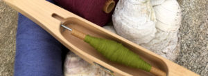 header image of yarn and shuttle
